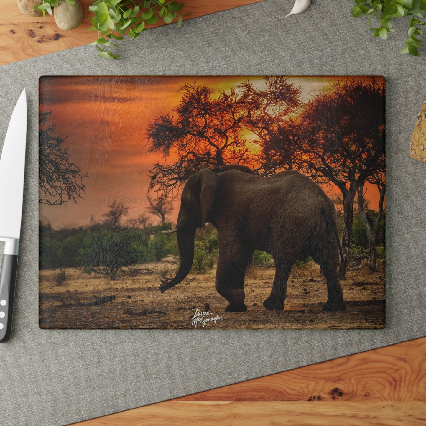 Enjoy Nature Glass Charcuterie Cutting Board with Spirited Elephant at Sunset Design