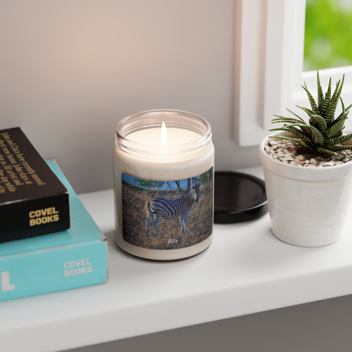 Experience the Pure Essence of Nature with the Baby Zebra Scented Soy Candle by Enjoy Nature