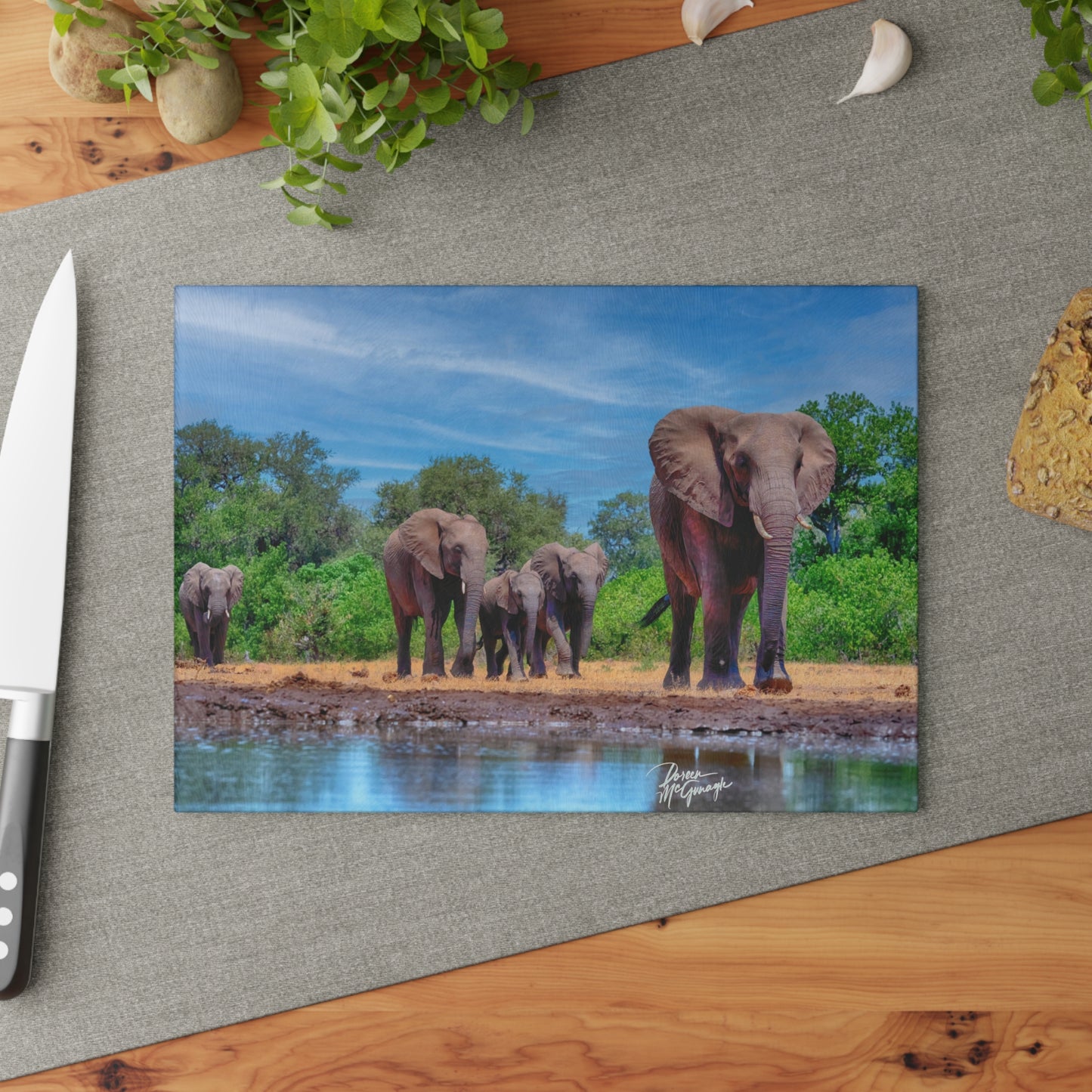 Enjoy Nature Glass Charcuterie Cutting Board with Elephant Family at Watering Hole Design