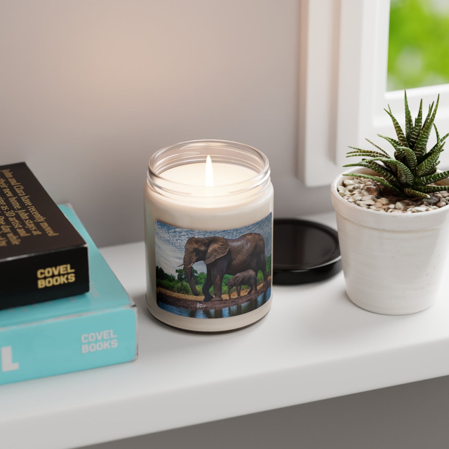 Experience the Pure Essence of Nature with the Spirited Elephant with baby Scented Soy Candle by Enjoy Nature