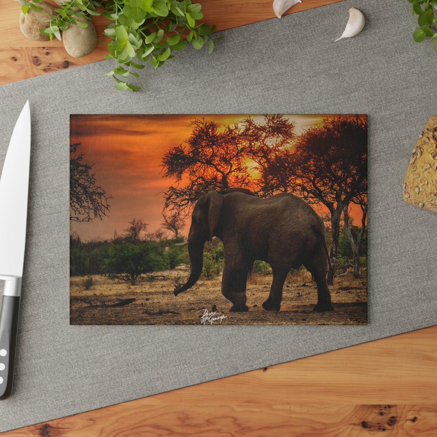 Enjoy Nature Glass Charcuterie Cutting Board with Spirited Elephant at Sunset Design